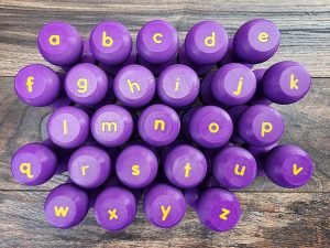 Alphabet Dough Stampers [Hard Good] - LOWERCASE LETTERS  (Purple/Yellow)